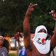 Protesters are forced by police from the business district into nearby neighborhoods in Ferguson, Mo., on Aug. 11, 2014. Police responded with tear gas and rubber bullets as residents and their supporters protested the shooting by police of an unarmed black teenager named Michael Brown, who was killed Aug. 9, 2014, in this suburban St. Louis community.
Scott Olson/Getty Images